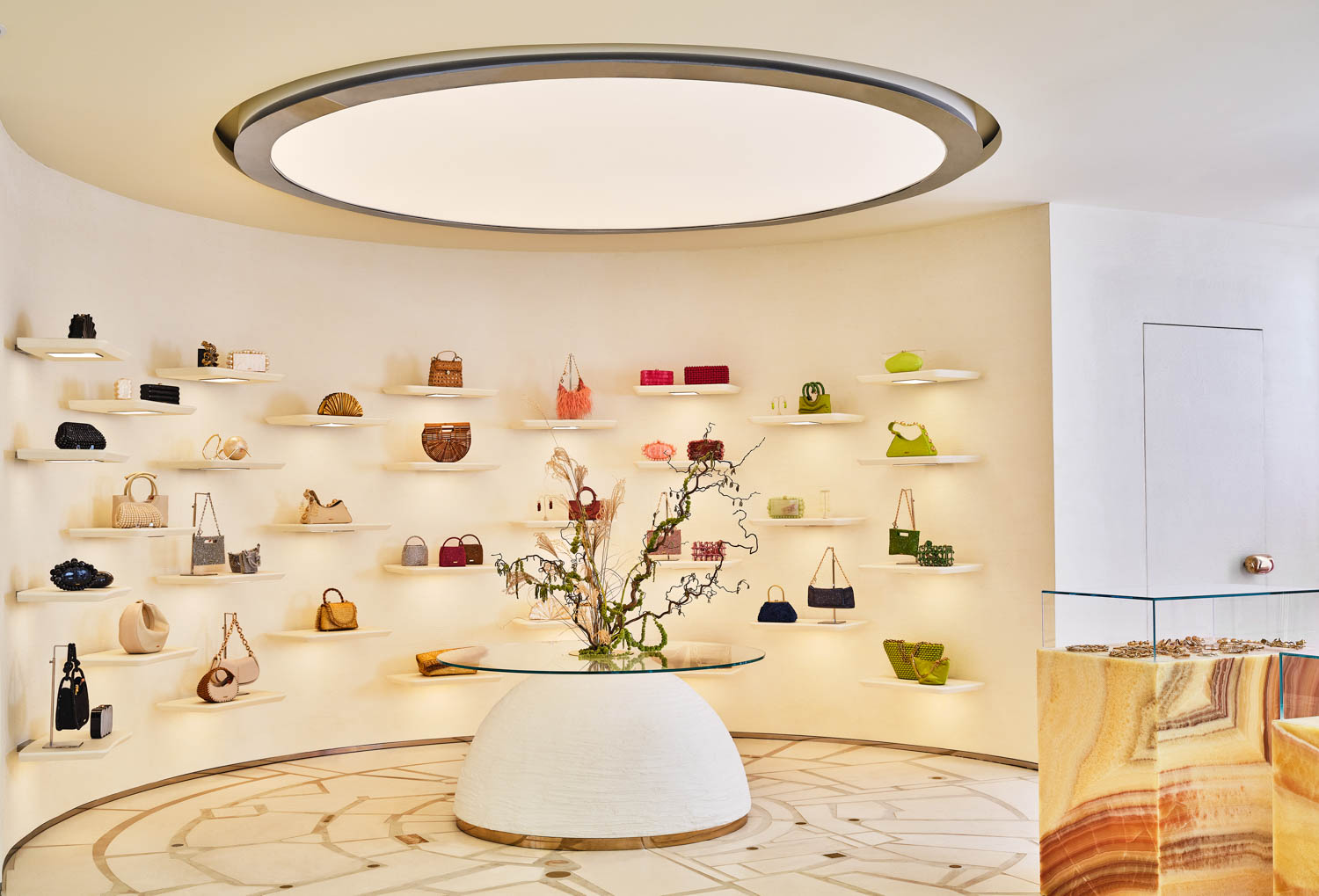 a skylight above a curved display wall at Cult Gaia