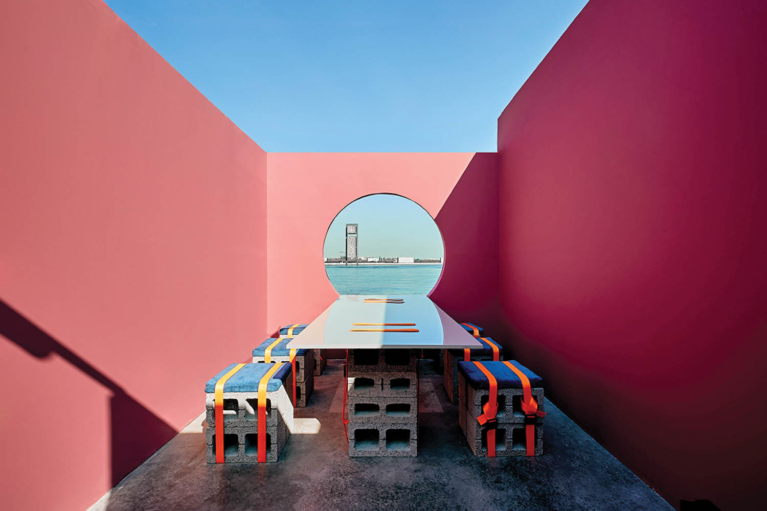 a colorful picnic table looking out through a keyhole opening