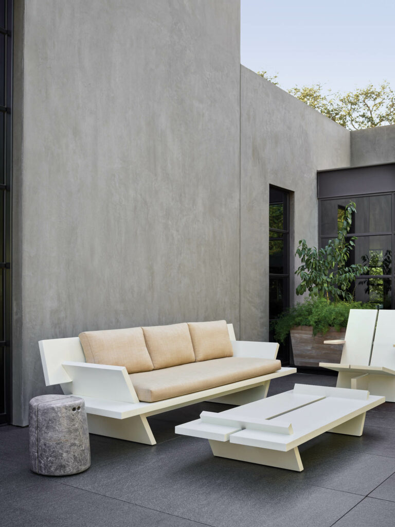 a white outdoor sofa on a patio