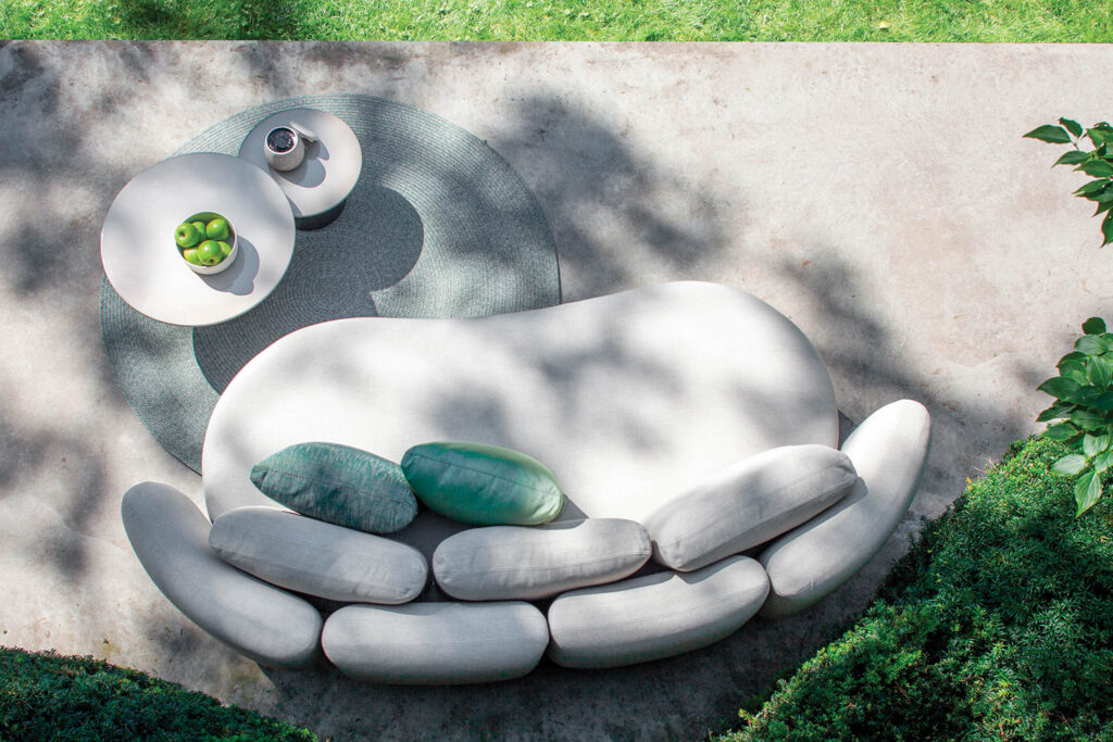 a white lounge sofa on a patio