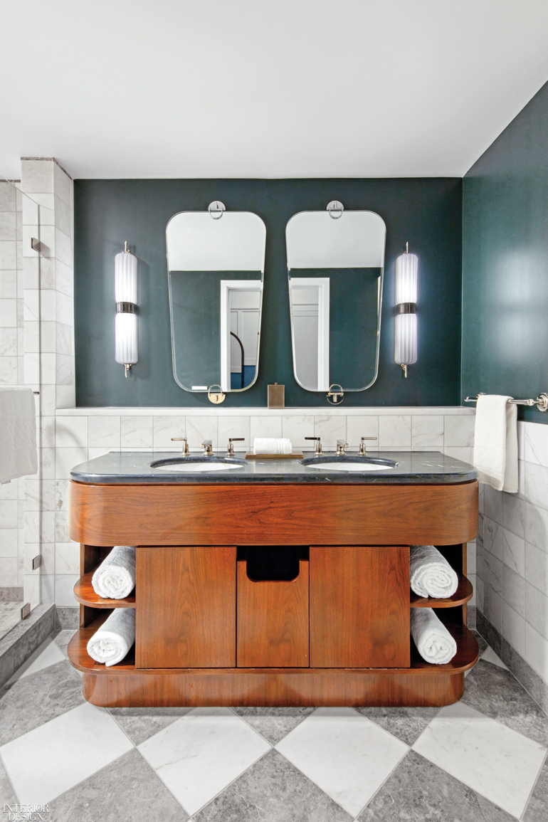 A guest bathroom in the hotel with a double sink and two mirrors