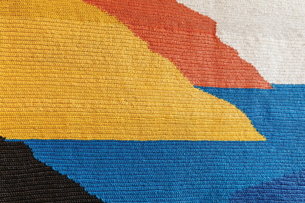 a textile with yellow orange and blue shades