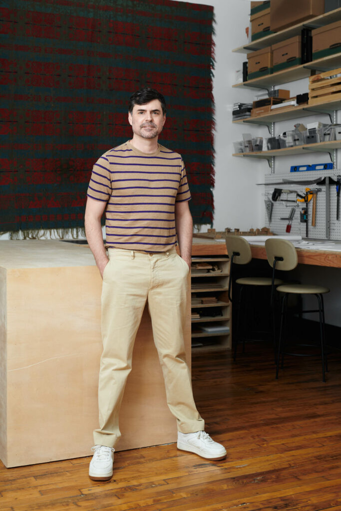 Jon Powell standing in his studio