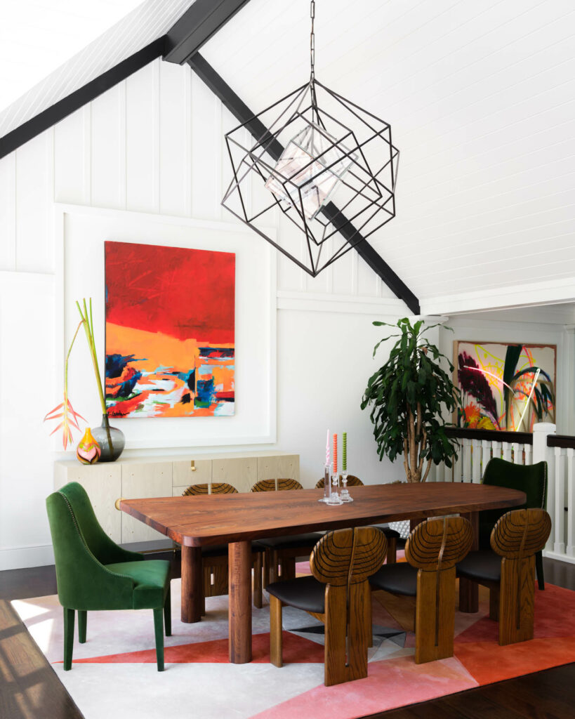 a living room with pitched ceiling and brightly colored furniture