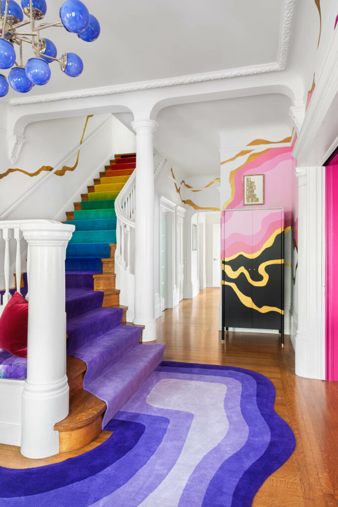 rainbow staircase leading to the home's front entrance