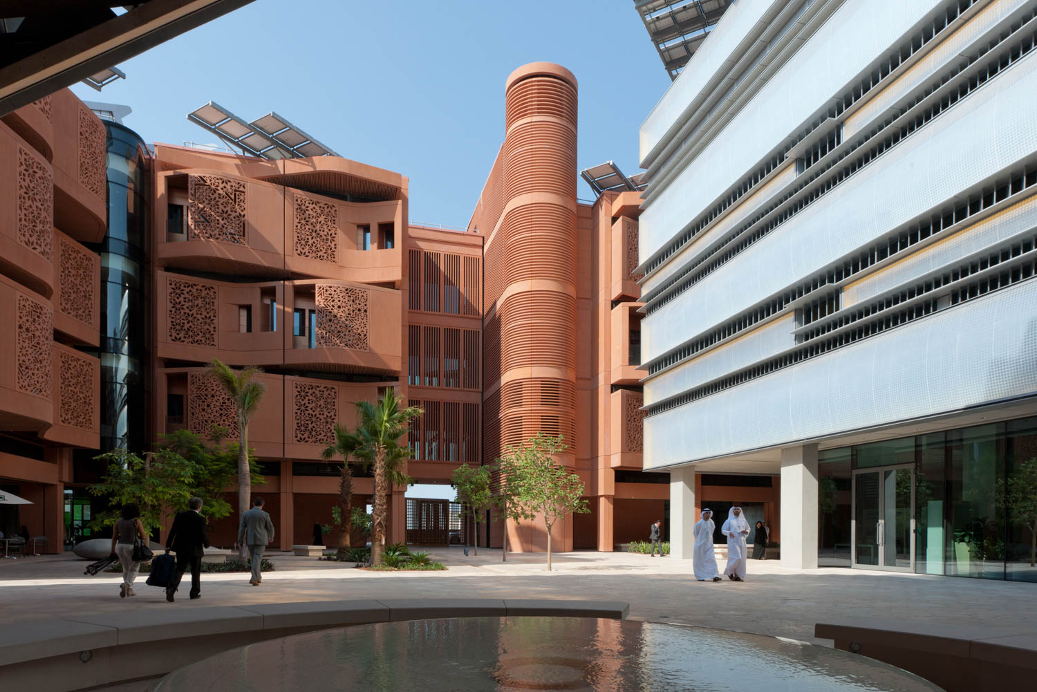 reddish tan building with a large courtyard