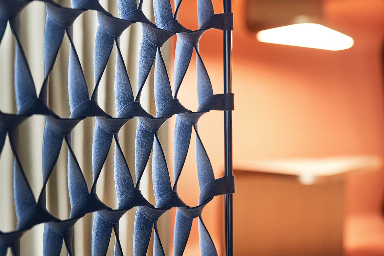 closeup of the blue lattice walls that surround the office