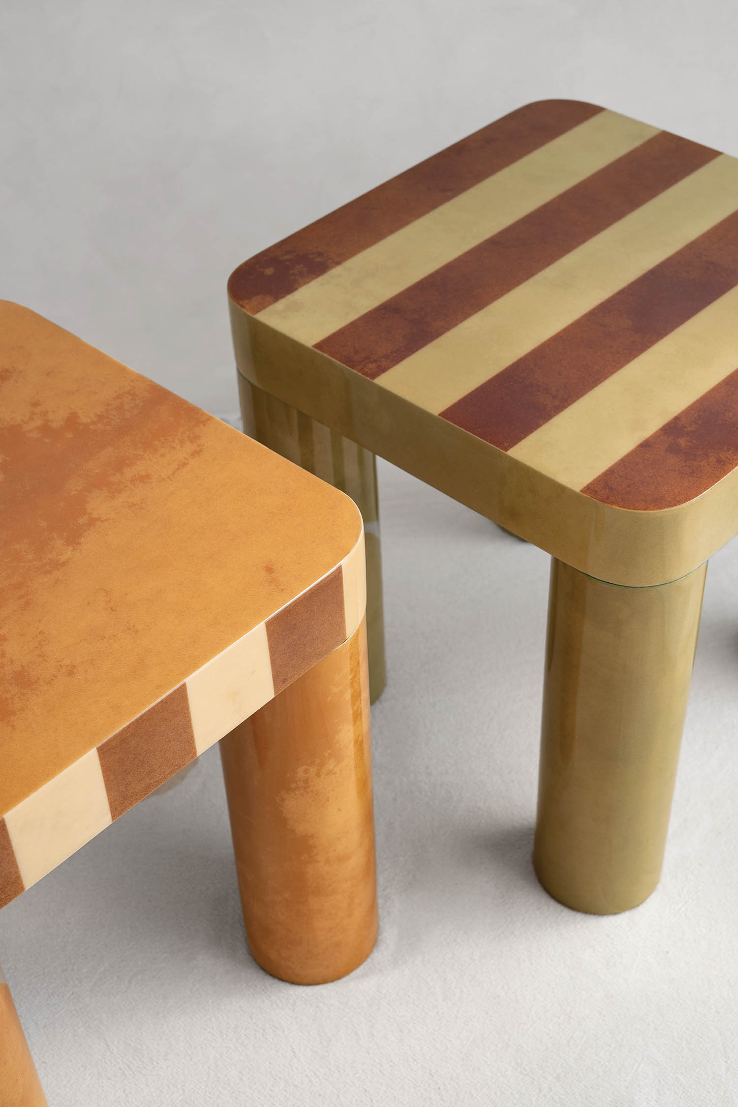 two striped tables next to each other