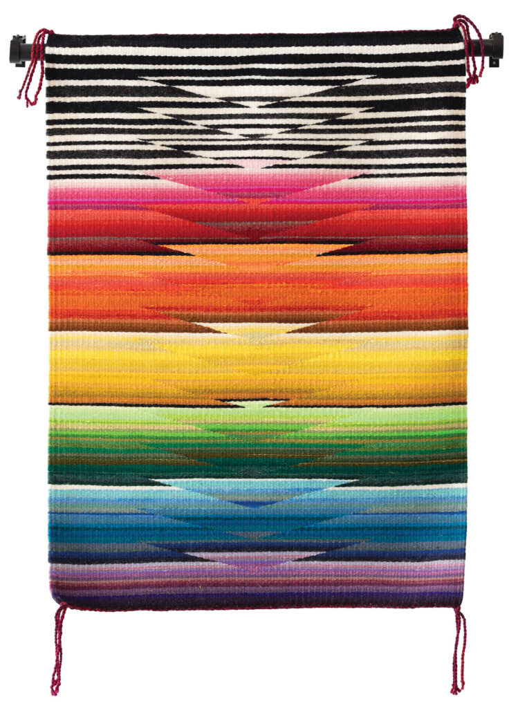 tapestry in rainbow colors with striped part on top