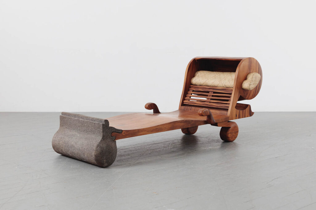 wooden daybed with stone base and wooden wheels