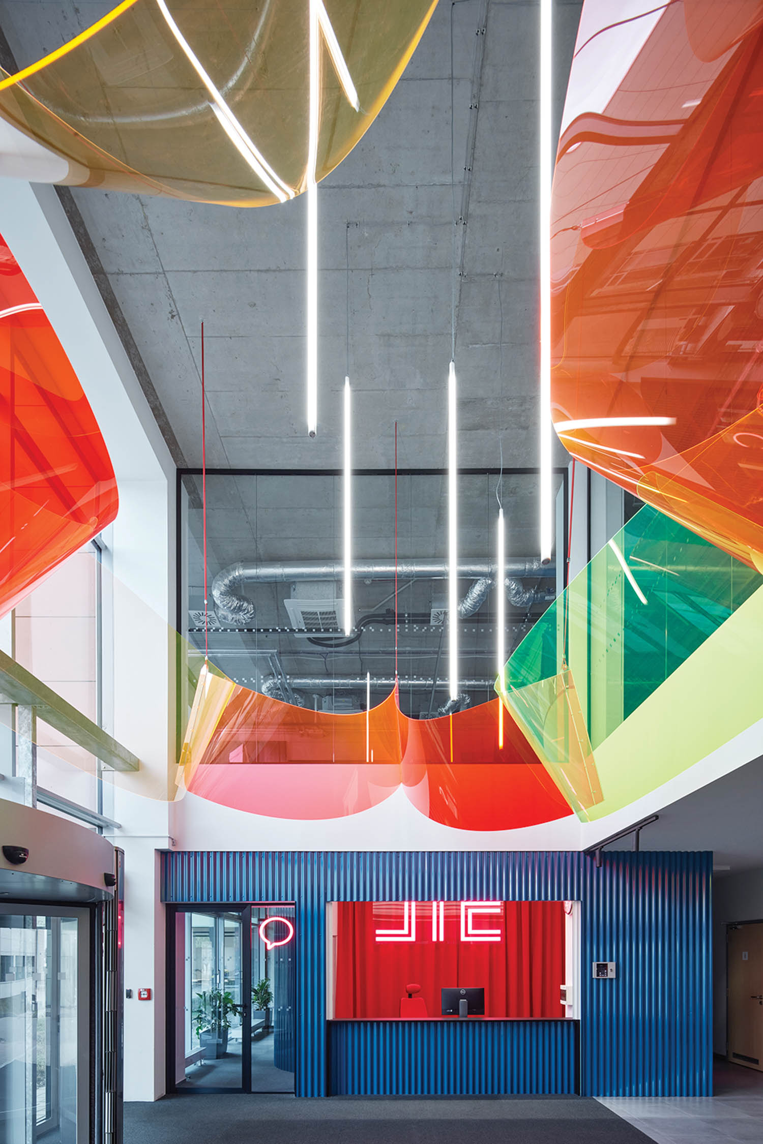 entrance with brightly colored panels hanging from ceiling