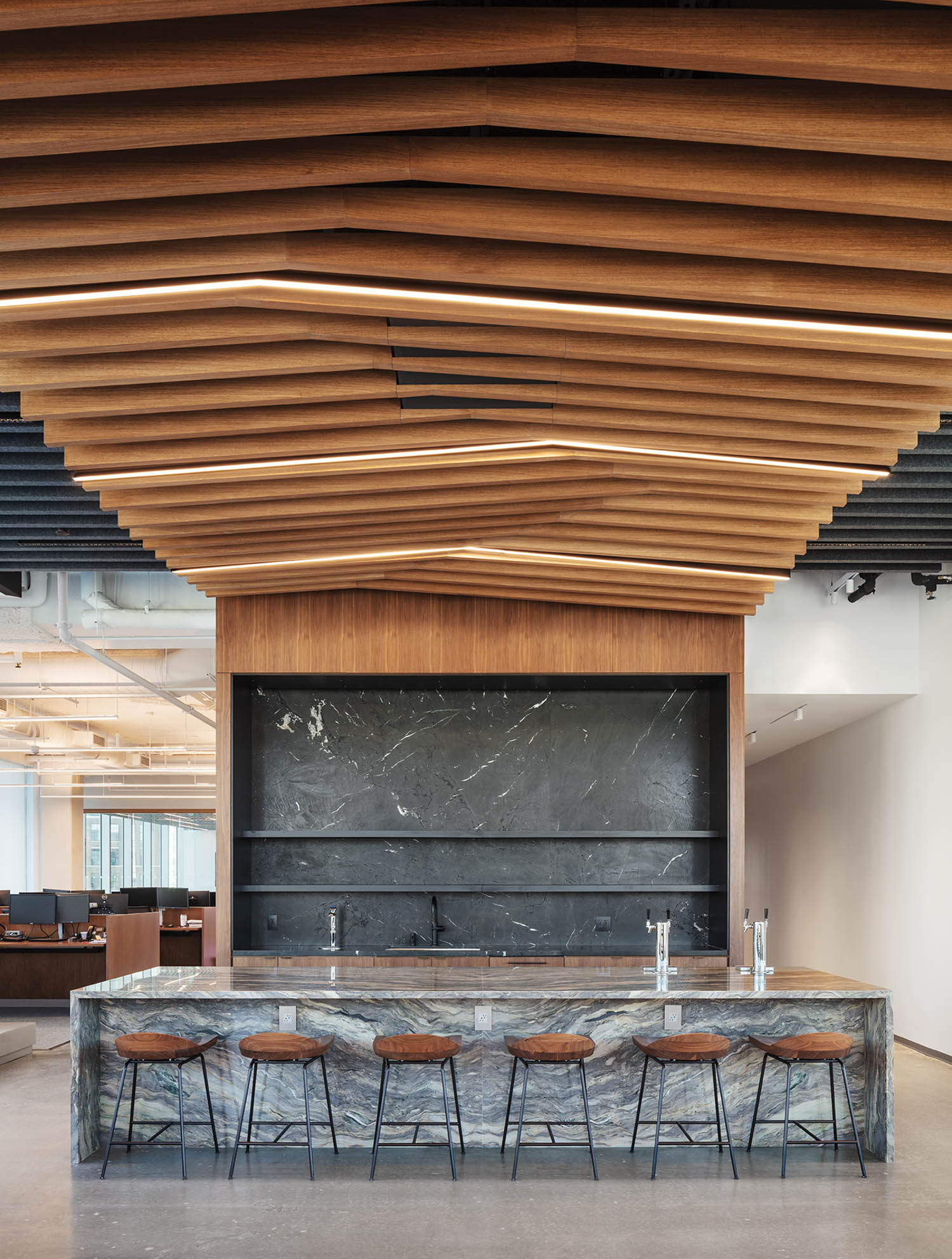 coffee bar area with grey marble countertops and wooden ceiling panels