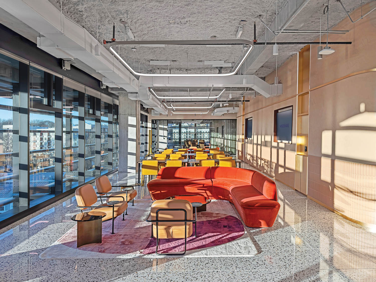 seating area with colorful chairs and sunlight