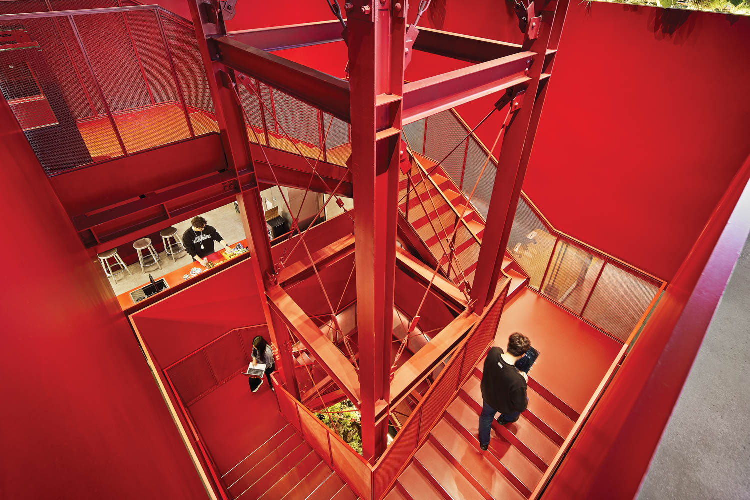 blood red stairway entry that covers multiple floors