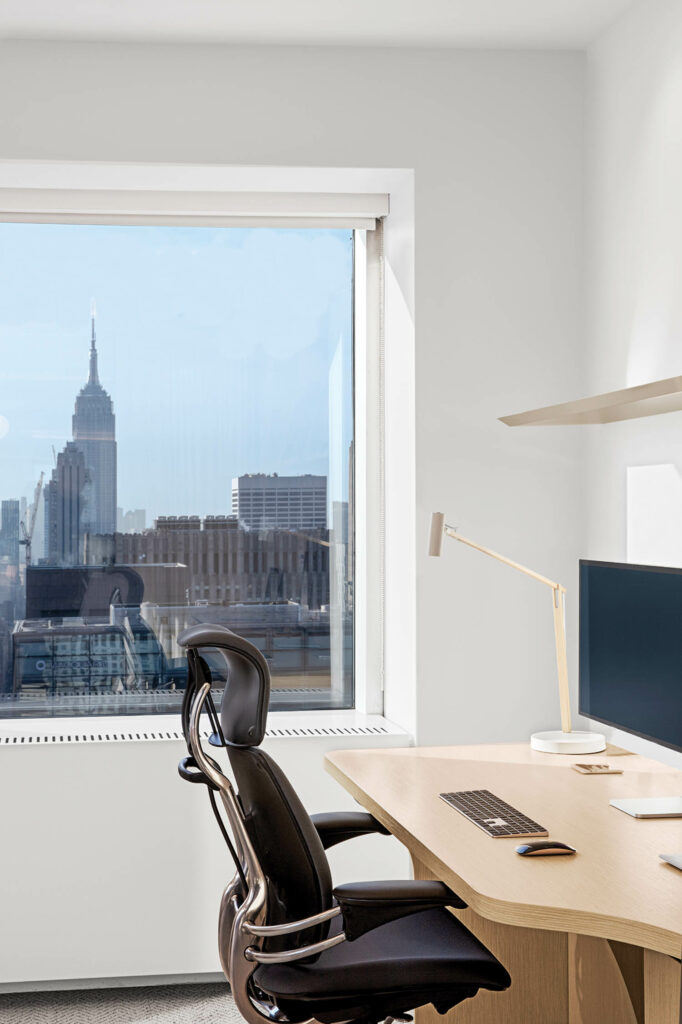 office with chair and view of the city