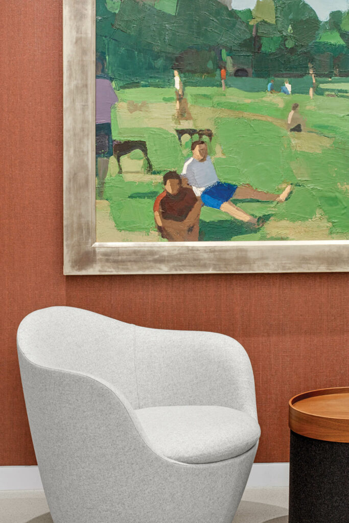 end of elevator lobby with artwork of people in the park