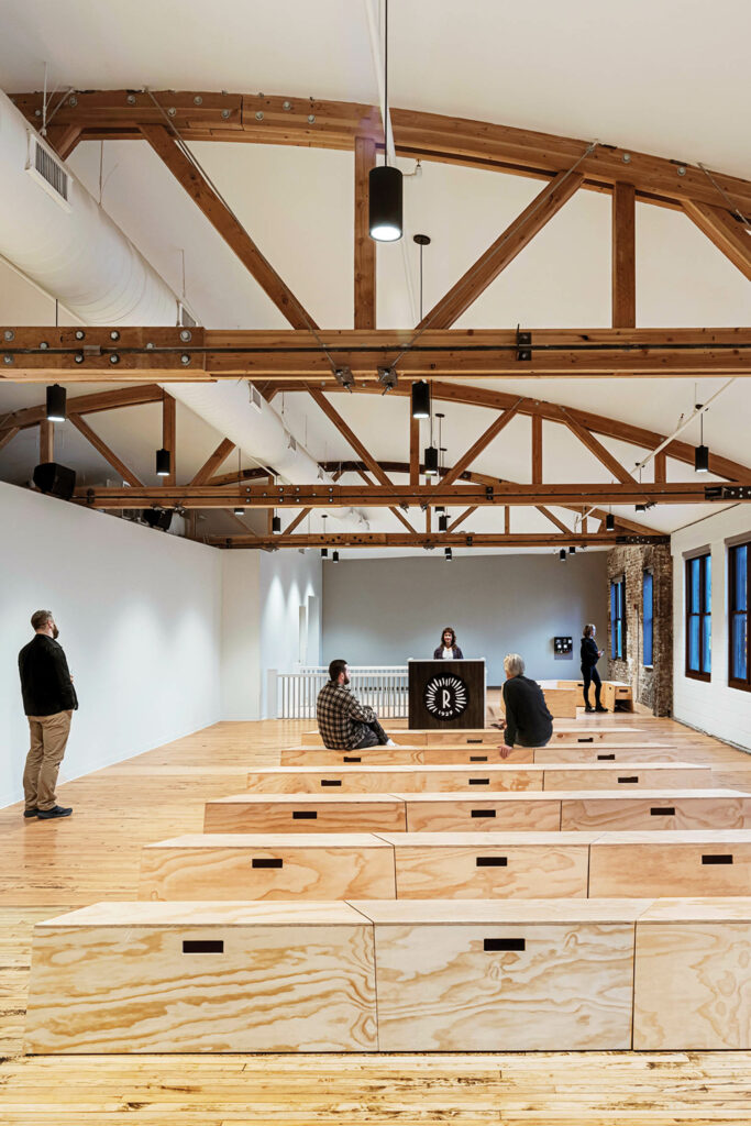 loft with wood benches and wooden structures on ceiling