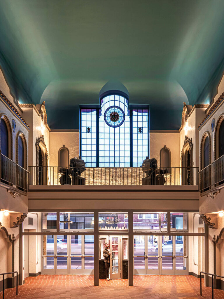 Spanish Revival–style lobby with preserved stained glass windows