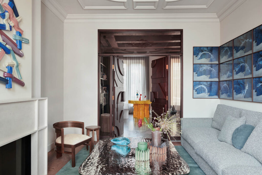 living room with light blue couch and view of kitchen