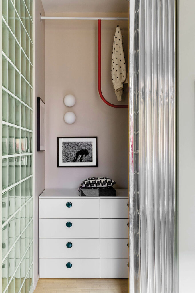 The main suite’s wardrobe area sports a space-saving foldable fabric door and a customized IKEA dresser.