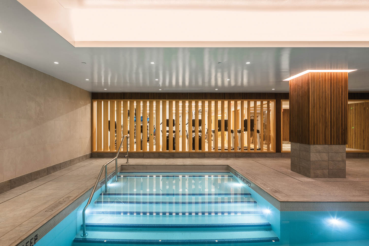 swimming pool with slatted wall panels and ambient light