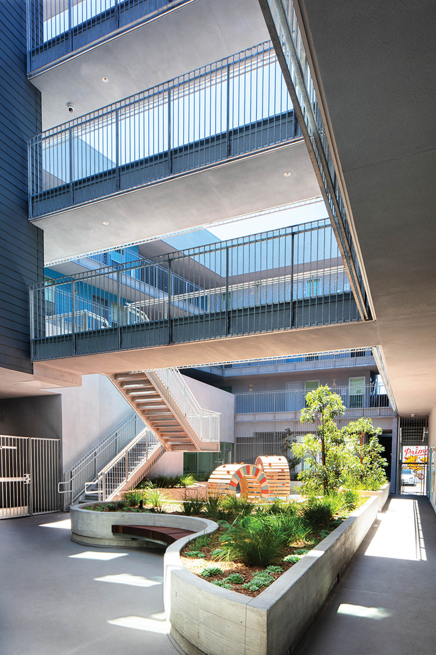 outdoor courtyard with flowerbeds and view of walkways