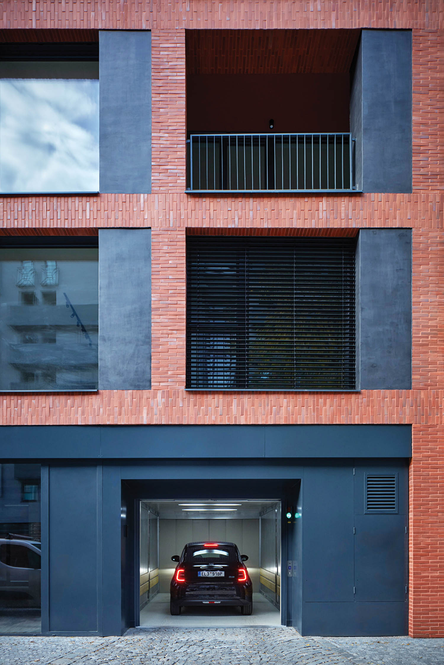 view of balconies and garage below