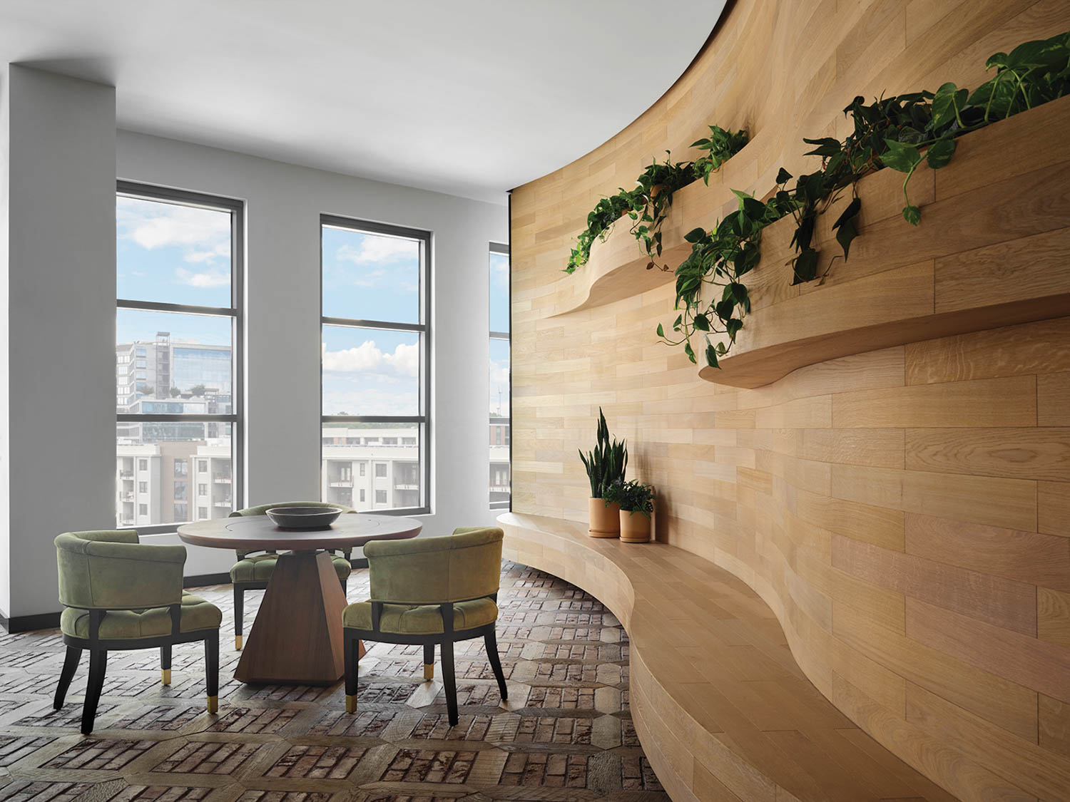 interior dining space with city view and greenery on walls