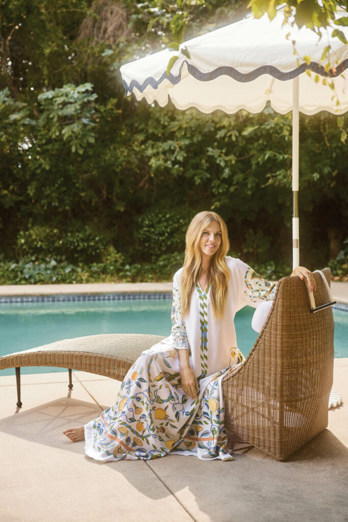 Sarah Sherman Samuel posing by the poolside