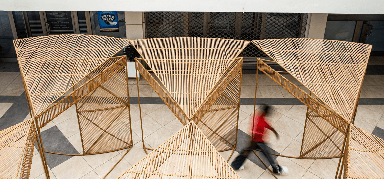 a man walks in front of the Waf Kiosk